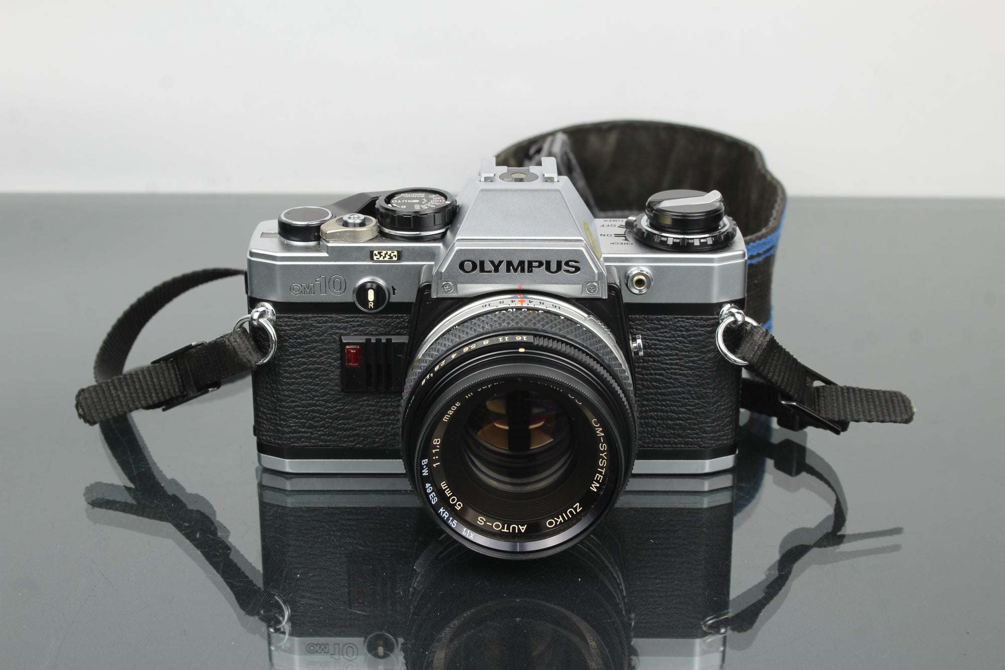 Olympus OM 10 + lente Olympus 50mm 1:1.8