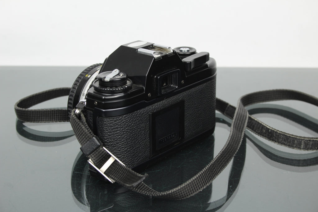 Nikon EM + 50mm 1:1.8 Series E lens