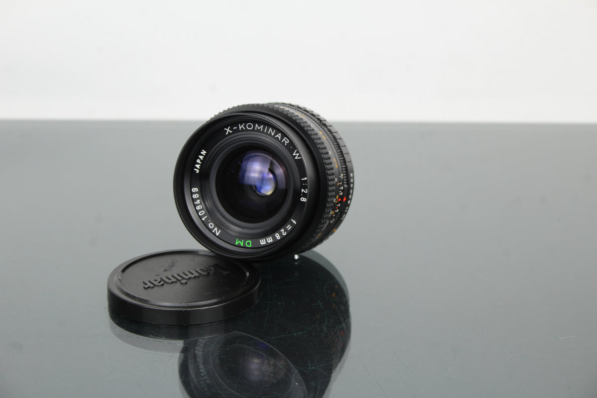 Kominar W 1:2.8 28mm Montagem Fujica