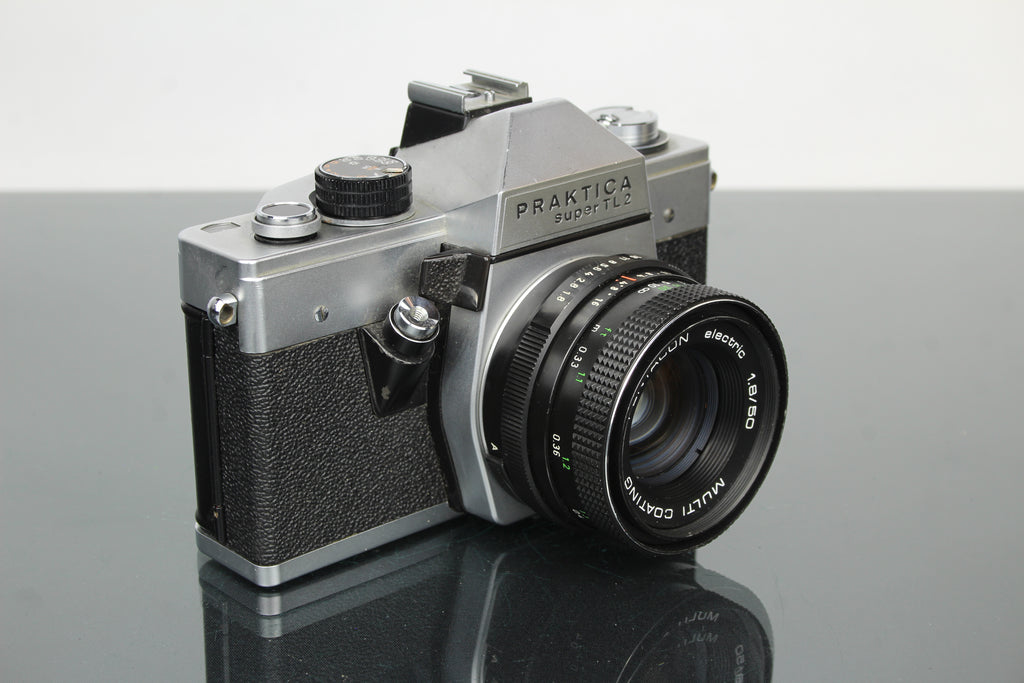 <tc>Praktica</tc> super TL2 + lente Pentacon elétrica 50mm 1.8 M42