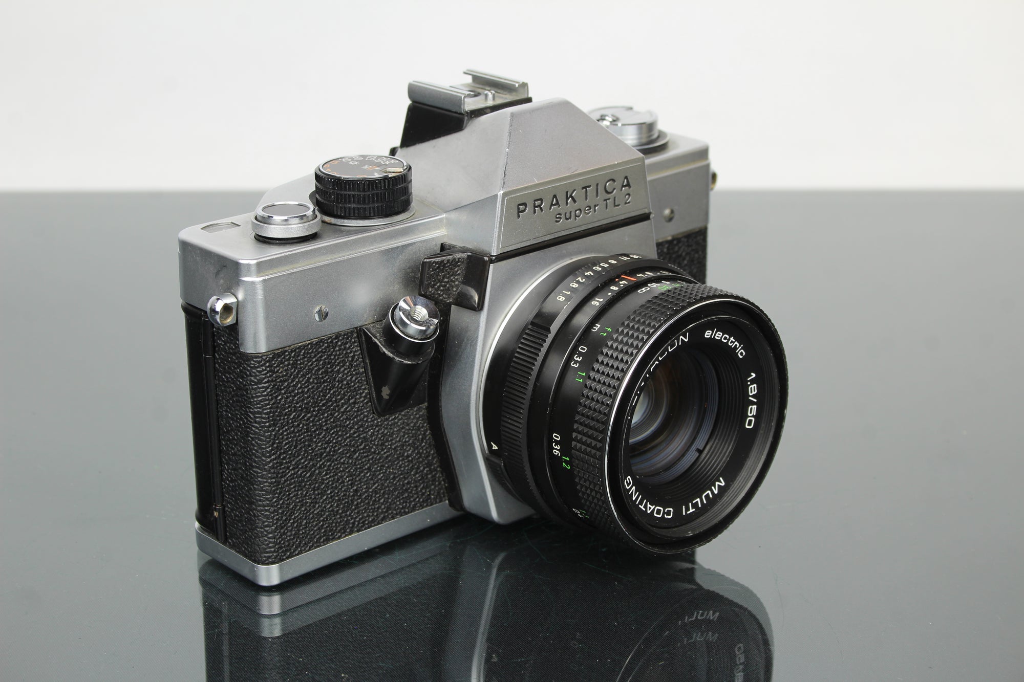 <tc>Praktica</tc> super TL2 + lente Pentacon elétrica 50mm 1.8 M42