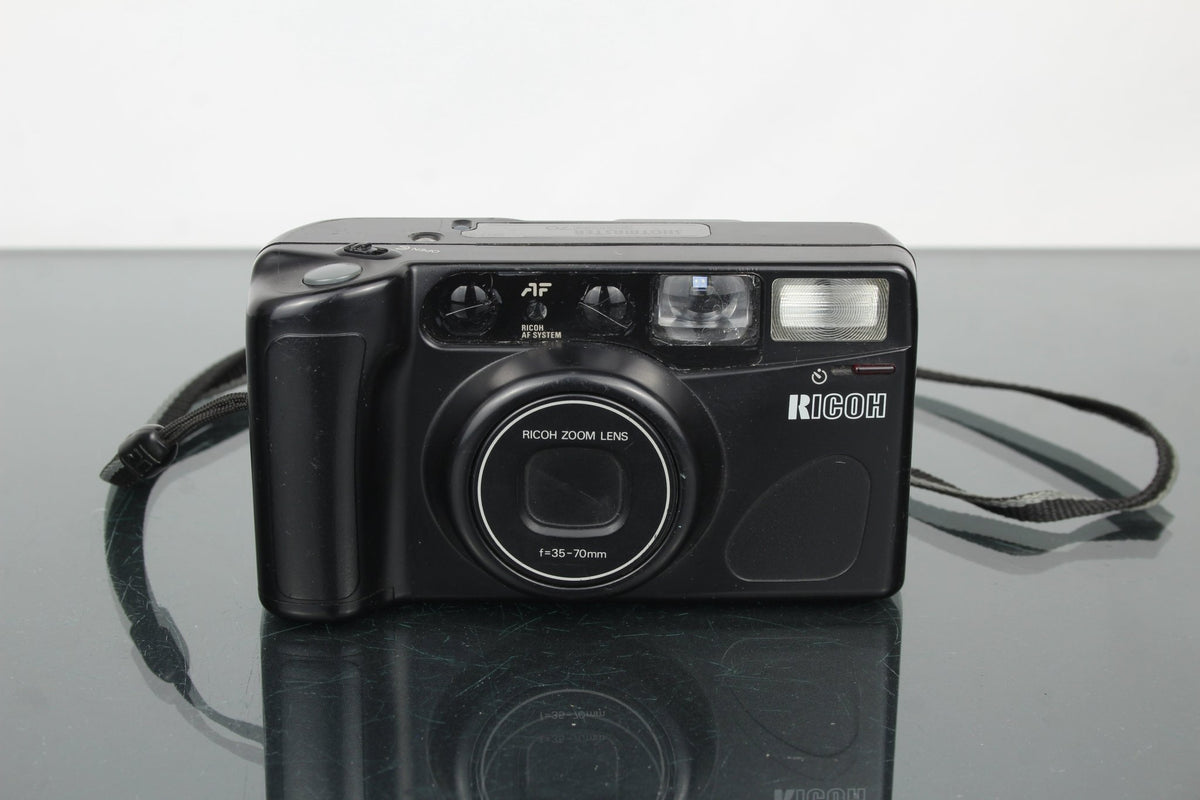 Ricoh Shotmaster Zoom 70 - Dutch|Thrift
